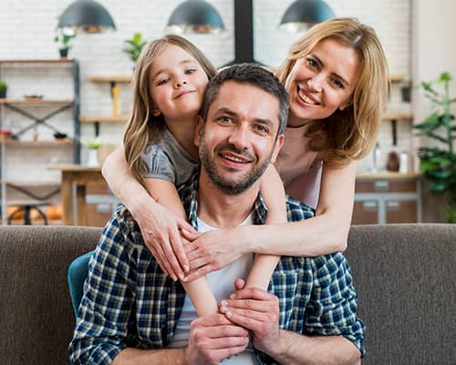 Happy Family Hugging Each Other After Home Purchase in Texas